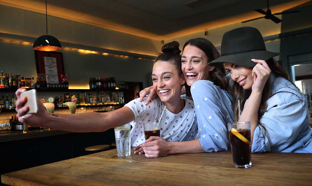 Young women in bar taking selfie - Londoner In Sydney walking-tour-in-sydney-adventure-clues