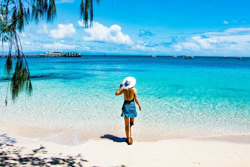 woman-looking-out-to-ocean-from-green-island-moving-to-london