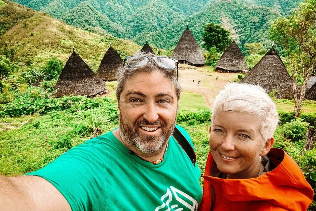 couple-in-front-of-wae-rebo-village-flores-indonesia